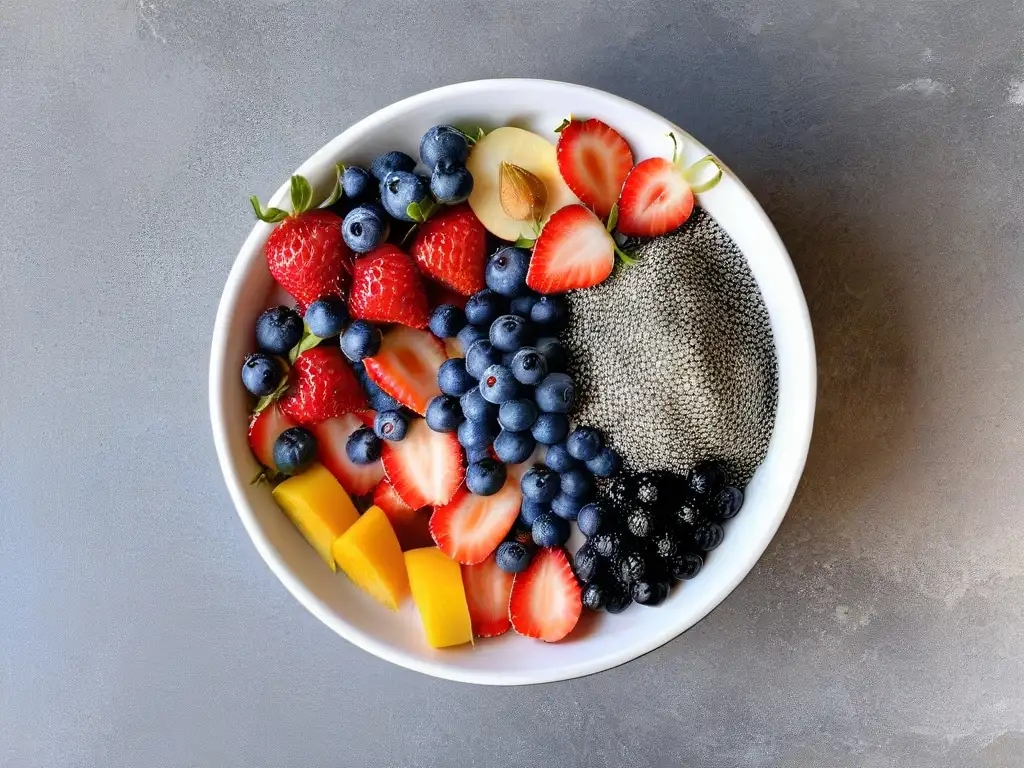 Una variedad de frutas y frutos secos coloridos en un tazón sobre una encimera de mármol